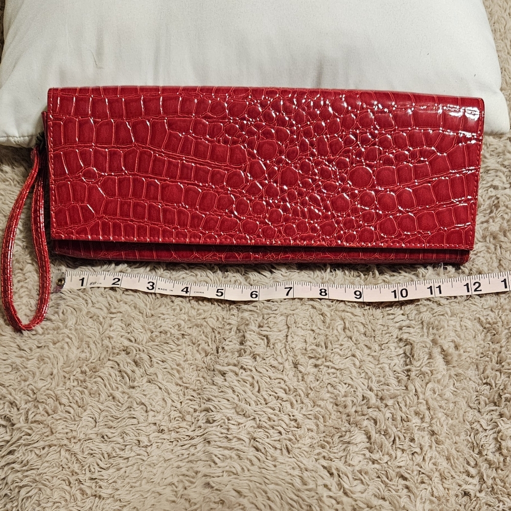 Red Croc-like patent leather clutch purse